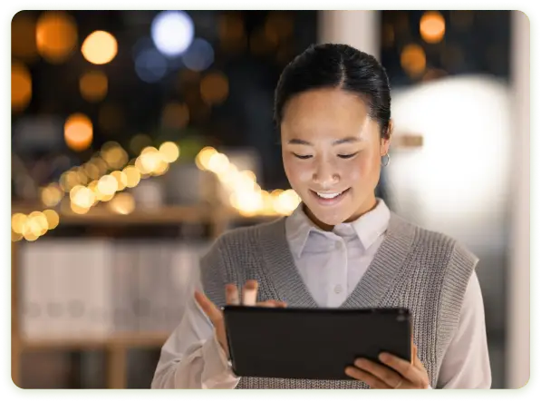 Woman using the SeatSocket real time seating map technology on her tablet