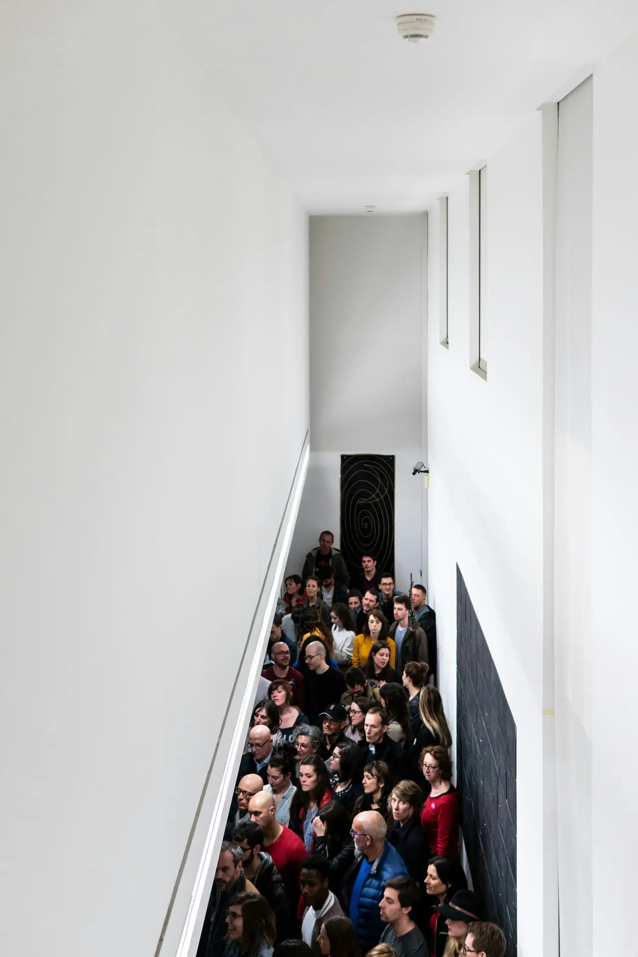 Crowd in line waiting to be admitted